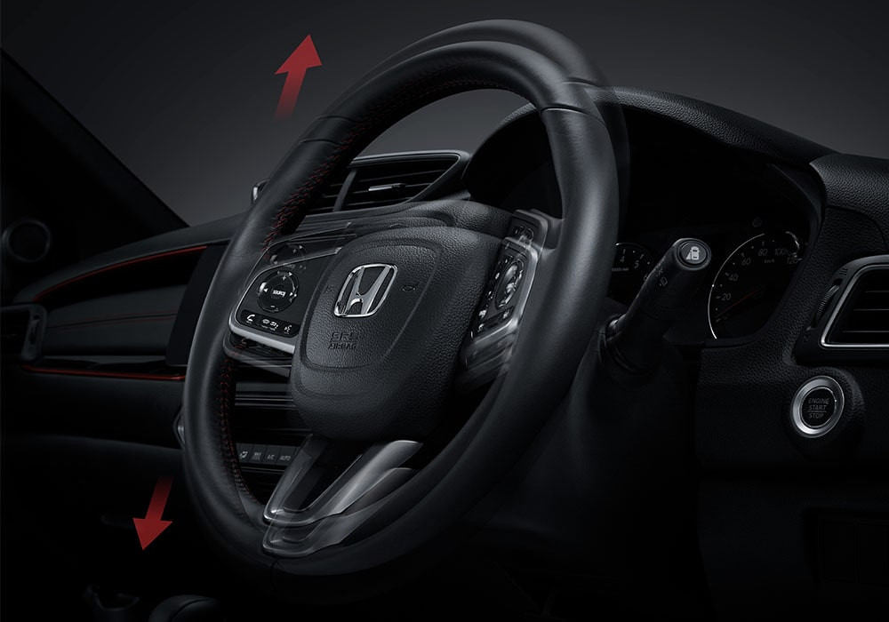 Tilt Steering Wheel
Anda bebas mengatur posisi naik atau turun roda kemudi sesuai dengan keinginan dan postur tubuh Anda.